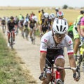 Arredondo Moreno Riding on a Cobblestone Road - Tour de France 2