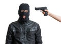 Arrested burglar or robber isolated on white background. Hand is aiming with pistol.