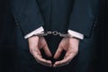 Arrested businessman in handcuffs with hands behind back Royalty Free Stock Photo