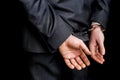 Arrested businessman in handcuffs with hands behind back Royalty Free Stock Photo