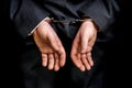 Arrested businessman in handcuffs with hands behind back Royalty Free Stock Photo