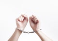 Arrested criminal hands in handcuffs