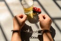 arrested drunk driver in jail with handcuffs