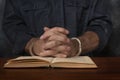 Criminal reads a law book Royalty Free Stock Photo
