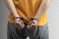 Arrested man with a handcuff on his hand Royalty Free Stock Photo