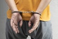 Arrested man with a handcuff on his hand Royalty Free Stock Photo