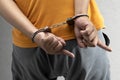 Arrested man with a handcuff on his hand Royalty Free Stock Photo