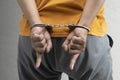 Arrested man with a handcuff on his hand Royalty Free Stock Photo