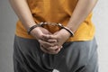 Arrested man with a handcuff on his hand Royalty Free Stock Photo