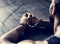 Arrested man with handcuffs on wrists Royalty Free Stock Photo