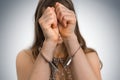 Arrested woman in handcuffs hidden her face Royalty Free Stock Photo