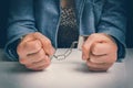 Arrested woman with handcuffs in police station Royalty Free Stock Photo