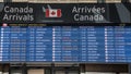 Arrivals board at Pearson Airport Toronto