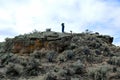 Owyhee Canyonlands Wilderness near Shoofly Oolite man on top of rock horizontal
