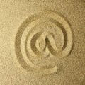 Arroba handwritten in the sand Royalty Free Stock Photo