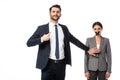 Arrogant businessman pointing with finger at himself and touching woman with scotch tape on mouth