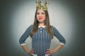 Arrogant disgruntled woman with golden crown. Selfish woman. Royalty Free Stock Photo