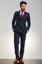 Arrogant elegant man in double breasted suit standing