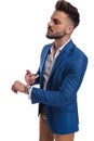 Arrogant man in suit pointing his finger to his watch Royalty Free Stock Photo