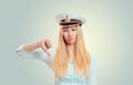 Arrogant woman in captain hat showing thumb down Royalty Free Stock Photo