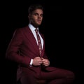 Arrogant young elegant man buttoning his suit Royalty Free Stock Photo