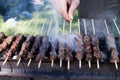 Arrosticini on the grill, Abruzzi skewers of sheep cooked on the Royalty Free Stock Photo