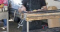 Arrosticini on the grill while turning, Abruzzi skewers of sheep Royalty Free Stock Photo