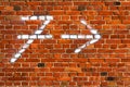 Arrow chalk written number seven wall red brickbackground Royalty Free Stock Photo