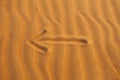 Arrow in the desert sand Royalty Free Stock Photo