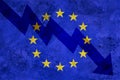 Arrow down on the background of the EU flag. The concept of economic recession, depression and crisis.