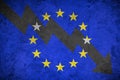 Arrow down on the background of the EU flag. The concept of economic recession, depression and crisis.