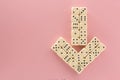 Arrow down. White gaming dices on pink background. victory chance and lucky. Flat lay style, place for text. Top view and Close-up