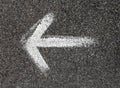 White arrow painted on the road Royalty Free Stock Photo