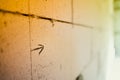 An arrow drawn with a pencil on a gas block wall close-up. The line drawn on the wall of aerated concrete bricks for builders.