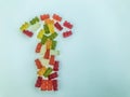 Arrow in the form of multi-colored and bright gummy bears. gelatinous delicious dessert. an appetizing treat for children and Royalty Free Stock Photo