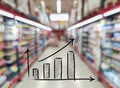 arrow growing on abstract blurred image of supermarket background. Bar charts and charts. Food prices rose. Inflation concept.