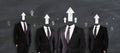 Arrow headed businessmen standing