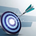 An arrow hitting the bullseye of a target. The target features concentric circles in Royalty Free Stock Photo