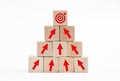 Arrow icons and target icon on wooden cubes. Financial growth, goal achievement or career development concept in business