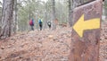 The arrow indicates the direction of the hiking trail and the direction of travel. Drawn on a metal suppo Royalty Free Stock Photo