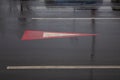 Arrow markings on wet asphalt in bad cloudy rainy weather Royalty Free Stock Photo