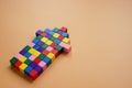 An arrow of multi-colored cubes as a symbol of unity, cooperation and teamwork.