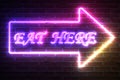 Arrow Neon Light Frame with Eat Here Sign. 3d Rendering Royalty Free Stock Photo