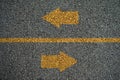 Arrow opposite directions on the on Asphalt roads Royalty Free Stock Photo
