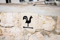 Arrow pointer with black cock on the way to Church of Saint Peter in Gallicantu, located on Mount Zion, Jerusalem, Israel