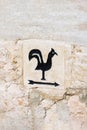 Arrow pointer with black cock on the way to Church of Saint Peter in Gallicantu, located on Mount Zion, Jerusalem, Israel