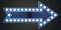 Blue arrow pointing right with electrical bulbs on dark background Royalty Free Stock Photo