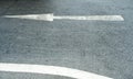 Arrow on the road and white colour Royalty Free Stock Photo