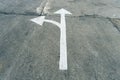 Arrow on the road and white colour Royalty Free Stock Photo