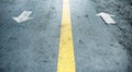 Arrow on the road and white colour Royalty Free Stock Photo